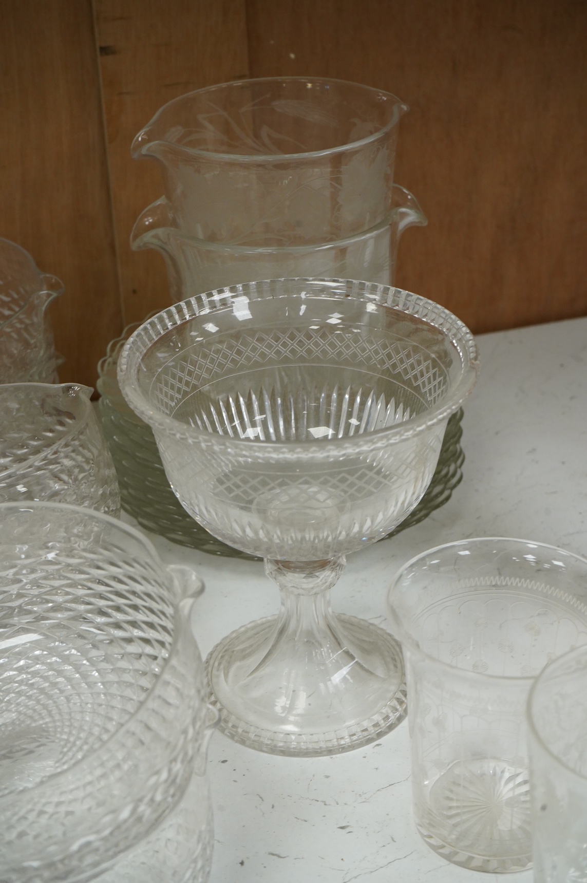 A collection of 19th century and later glassware, to include: Three fluted wine glasses two rummers, various risers and finger bows, decanters etc